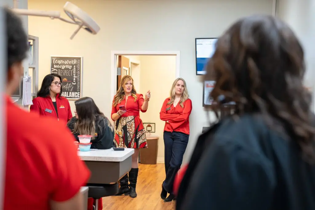 Veterinarian and staff huddle
