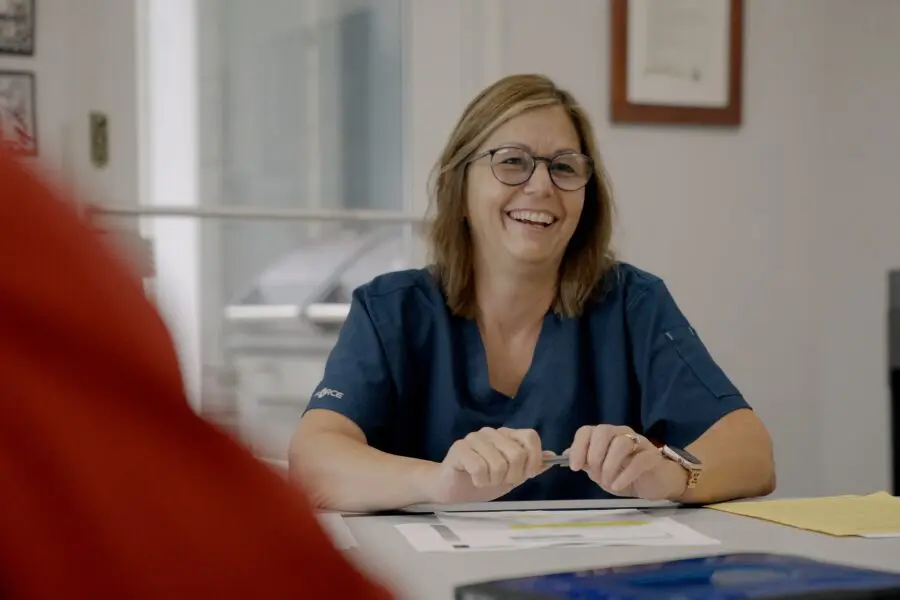 Veterinary manager reviewing practice numbers